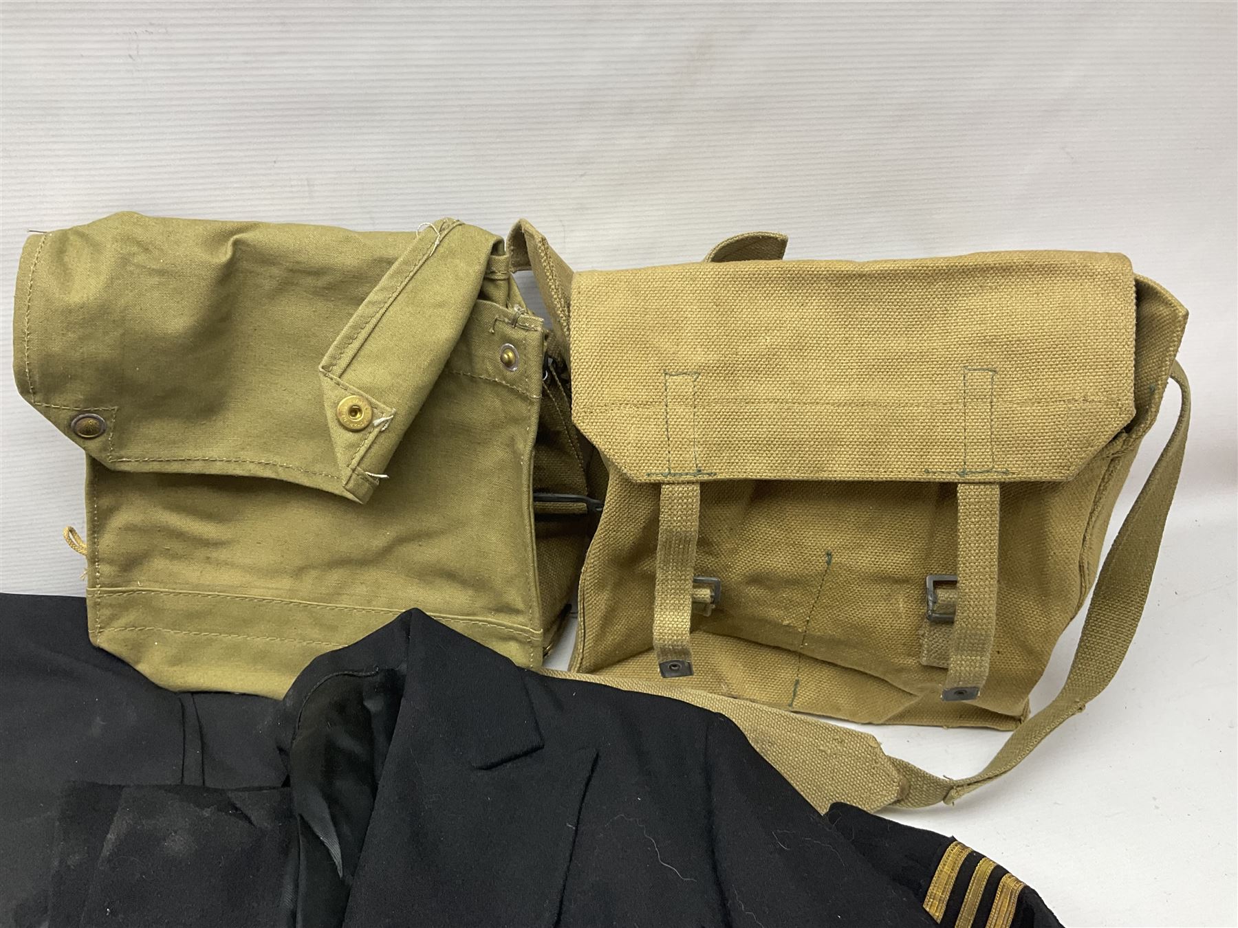 Two post-WWII British Army No.2 Dress tunics, one with Green Howards buttons; army shirt dated 1951; Royal Fleet Auxilliary jacket with trousers; three RAF/WAAF uniforms and RAF Greatcoat; and three canvas/webbing bags, two dated 1943 & 1945