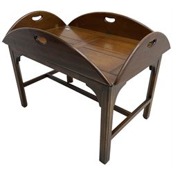 Mahogany butler's tray top coffee table, the removable tray with hinged sides and ends pierced with handles, on square moulded supports united by H stretcher 