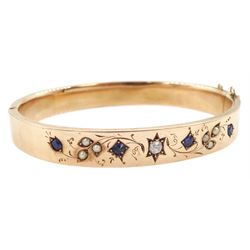 Early 20th century 9ct rose gold sapphire, old cut diamond and pearl hinged bangle, with foliate decoration