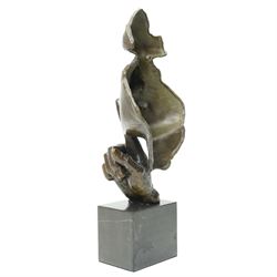After Salvador Dali (Spanish 1904-1989) 'Serenity'- bronze figure with finger held to mouth, on black marble plinth H47cm