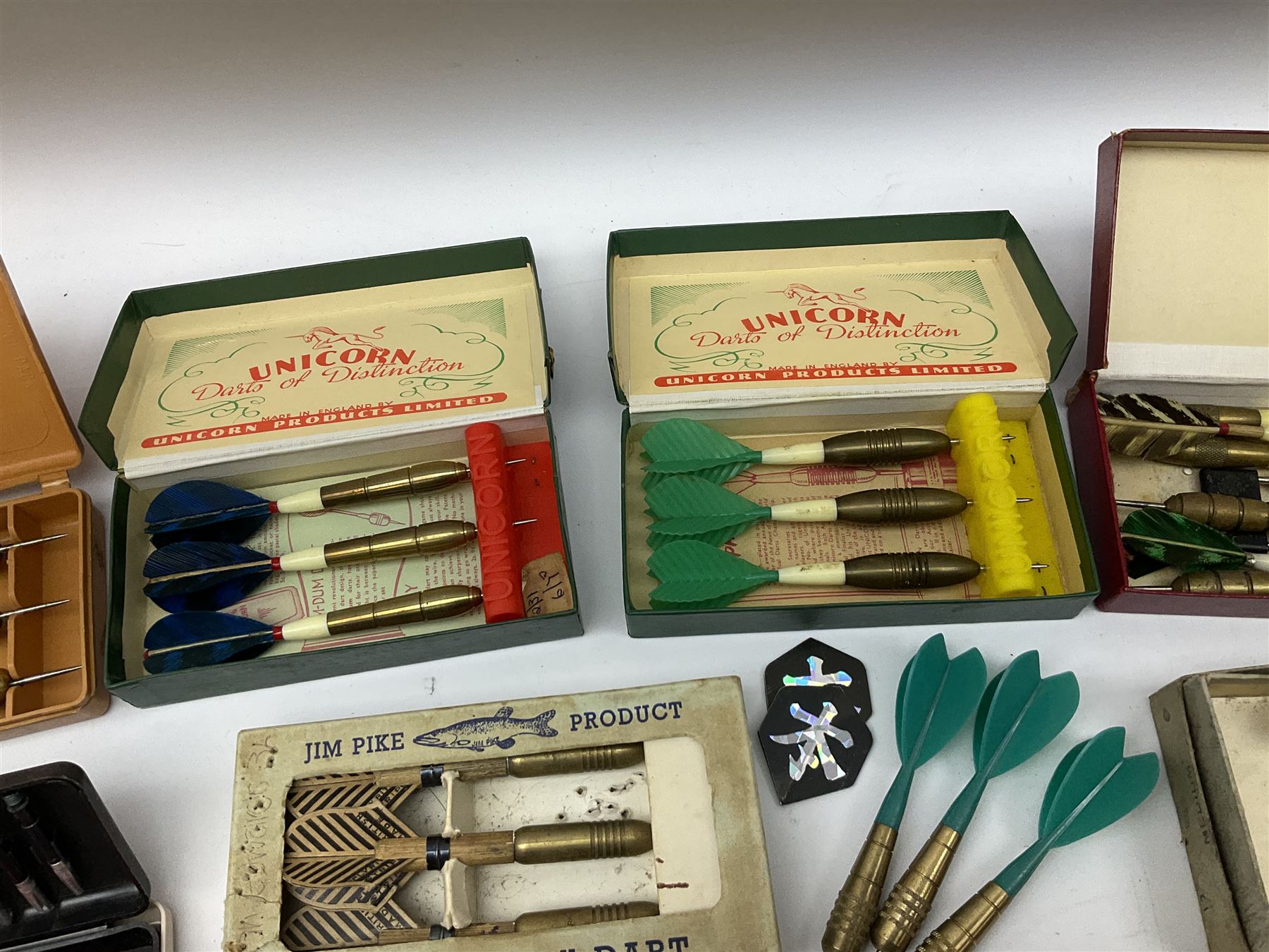 Nineteen sets of dartboard darts by Unicorn, Jim Pike, 'One-o-One', Farebrother etc, with various flights, shafts, styles and weights; predominantly boxed