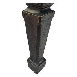 Late Victorian Gothic-revival armchair, arched crest rail carved with tracery and trefoil detail, padded circular back and seat, brass studded burgundy leather upholstery, shaped armrests with scrolled terminals, on square tapering supports