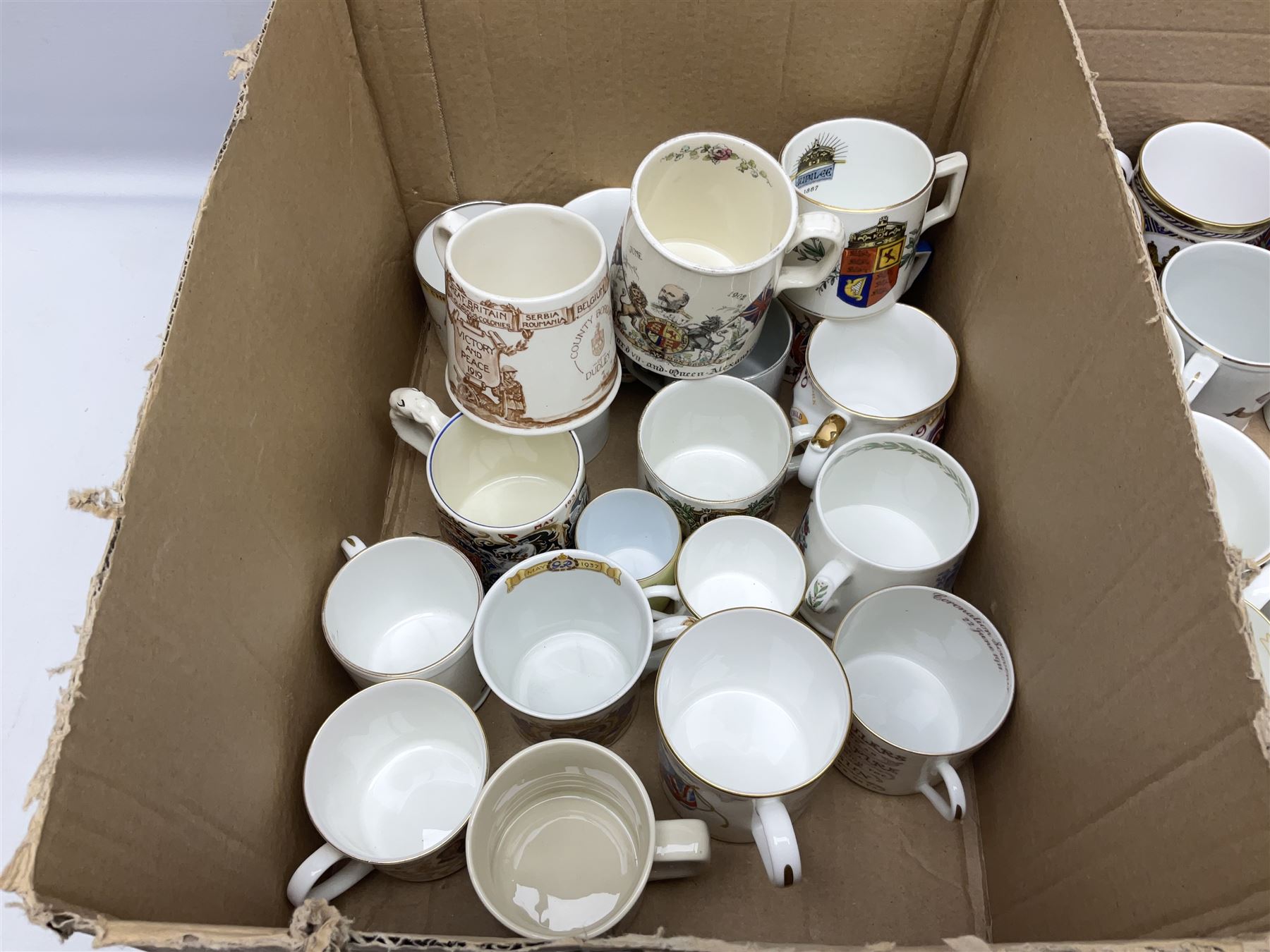 Collection of Victorian and later commemorative mugs, to include Queen Victoria 1887 Jubilee cup, Rd No. 64761, Royal Doulton Victory and Peace mug, 1919, Rd 666159, Royal Doulton King Edward VII blue transfer coronation, Royal Doulton 1937 George Coronation, Harrods Limited Rulers Of An Empire on Which The Sun Never Sets, Royal Worcester Victory in the Gulf, two Shelley examples, Spode limited edition Queen Elizabeth II Golden Jubilee etc in two boxes