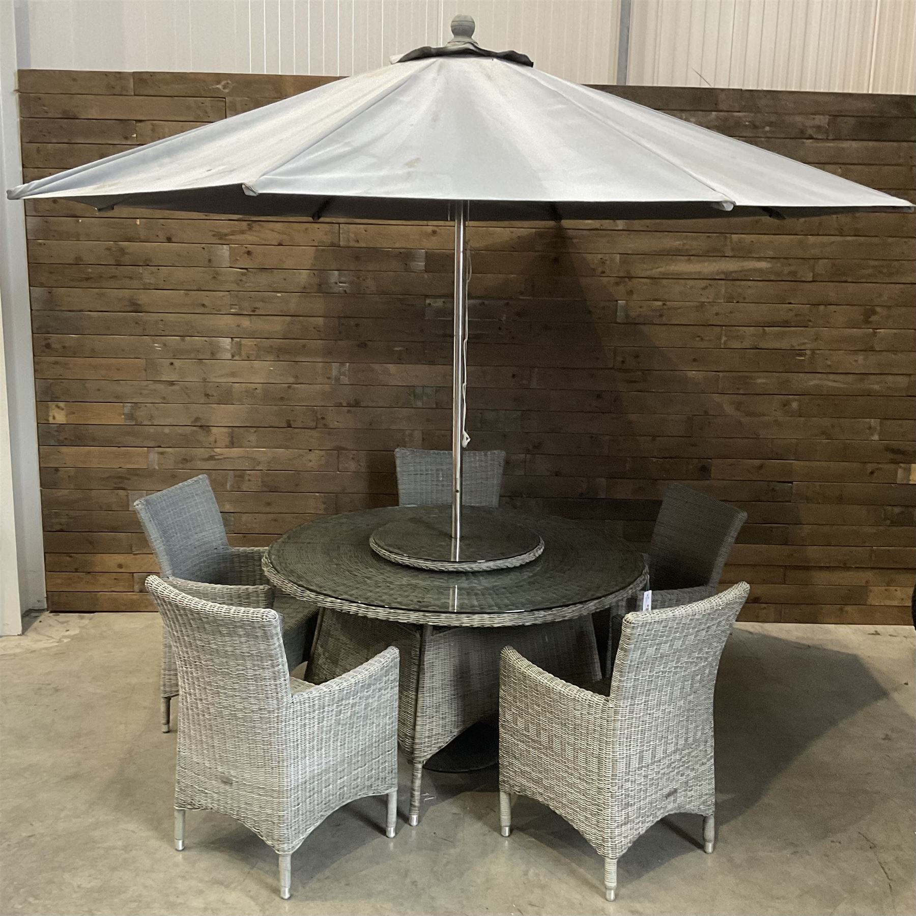 LeisureGrow circular rattan garden table, with lazy Susan, five armchairs with cushions, parasol and weighted base, with glass tops