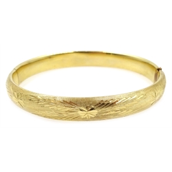  14ct gold (tested) hinged bangle with engraved decoration, approx 8.7gm   