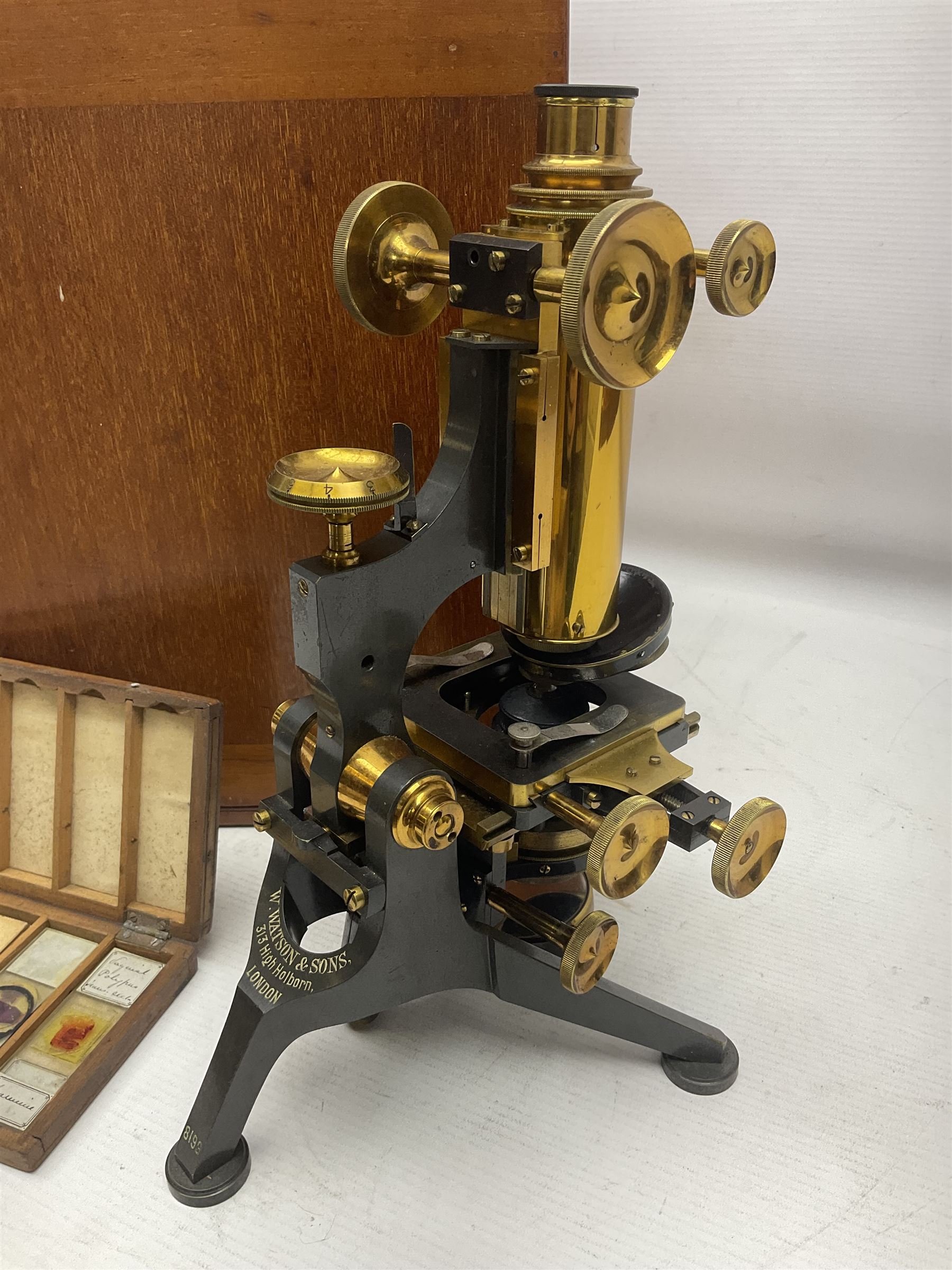 W. Watson & Sons Ltd lacquered brass compound microscope circa 1910, the back foot signed W. Watson & Sons Ltd, 313 High Holborn London and numbered 8193, together with a boxed collection of glass microscope biological sample slides