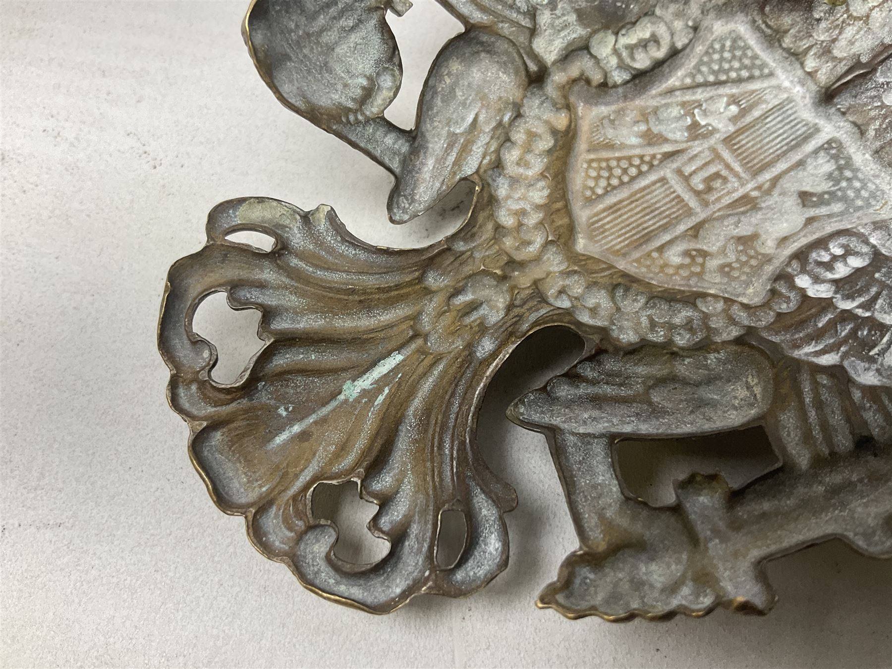 Austrian shako plate 1890 - 1914 with three fixing eyes verso