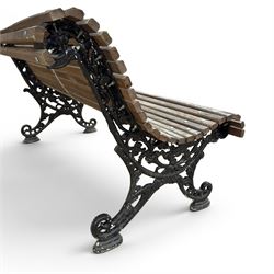 19th century cast iron and wood slatted garden bench, serpentine scroll form, ornate bow ends finished in green paint