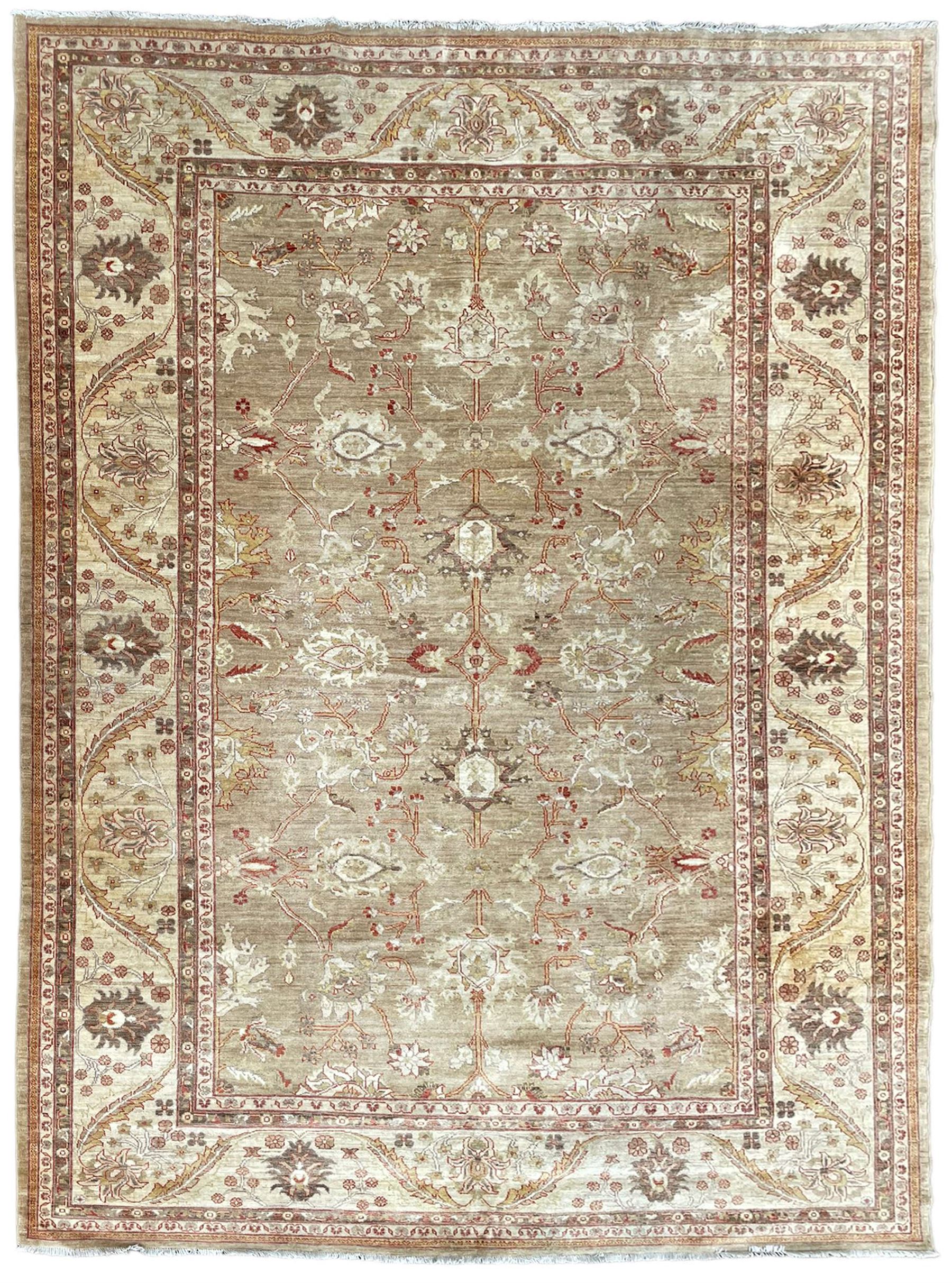 Pakistani ivory ground carpet, the field decorated with leaf branches, lotus flowers and roses, wide guarded border long leaves and stylised plant motifs