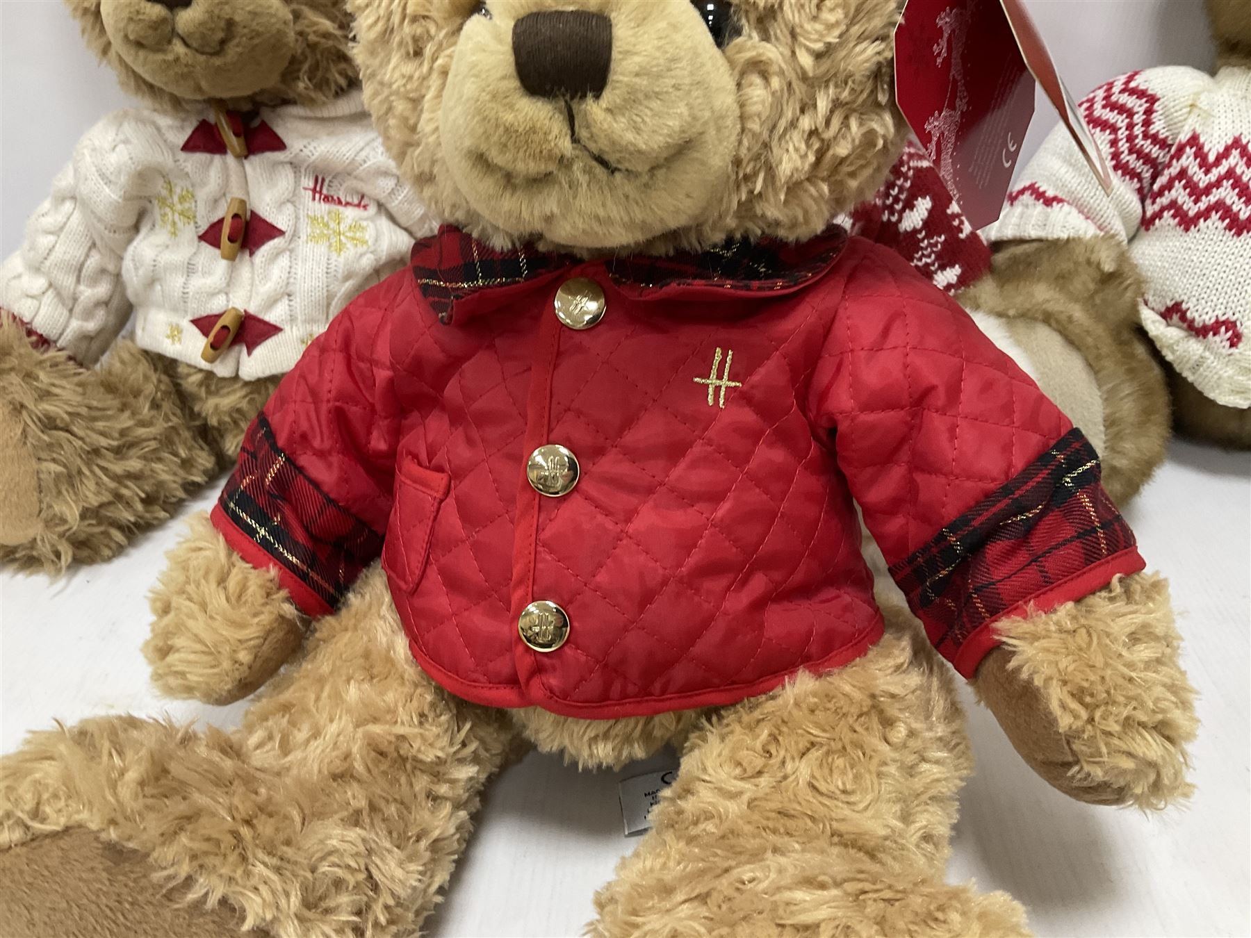 Six Harrods annual teddy bears, dating between 2011 and 2016, tallest H38cm