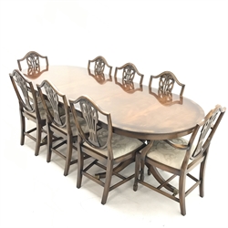G T Rackstaw - Georgian style cross banded mahogany twin pedestal dining table, turned columns on brass capped shaped supports (W184cm and W246cm, H78cm, D104cm) and set eight (6+2) Hepplewhite style chairs, upholstered seat, square tapering supports on spade feet (W57cm)