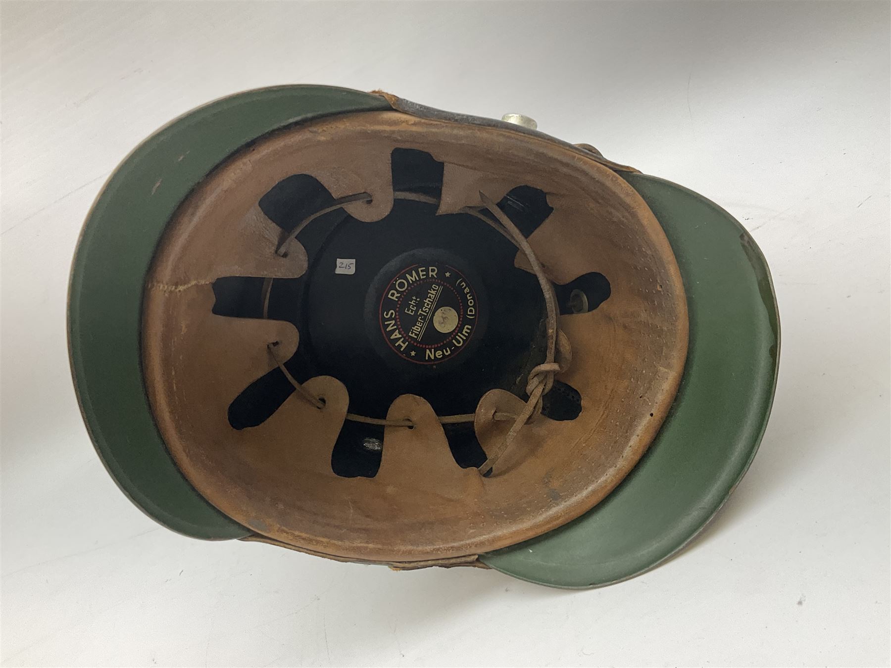 WW2 German rural police shako with helmet plate and liner; bears label 'Hans Romer Echt Fiber-Tschako Neu-Ulm (Donau)'