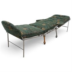 Victorian foldable day bed, button back padded arms, reupholstered in a green fabric with Latin script, turned feet with ceramic castors