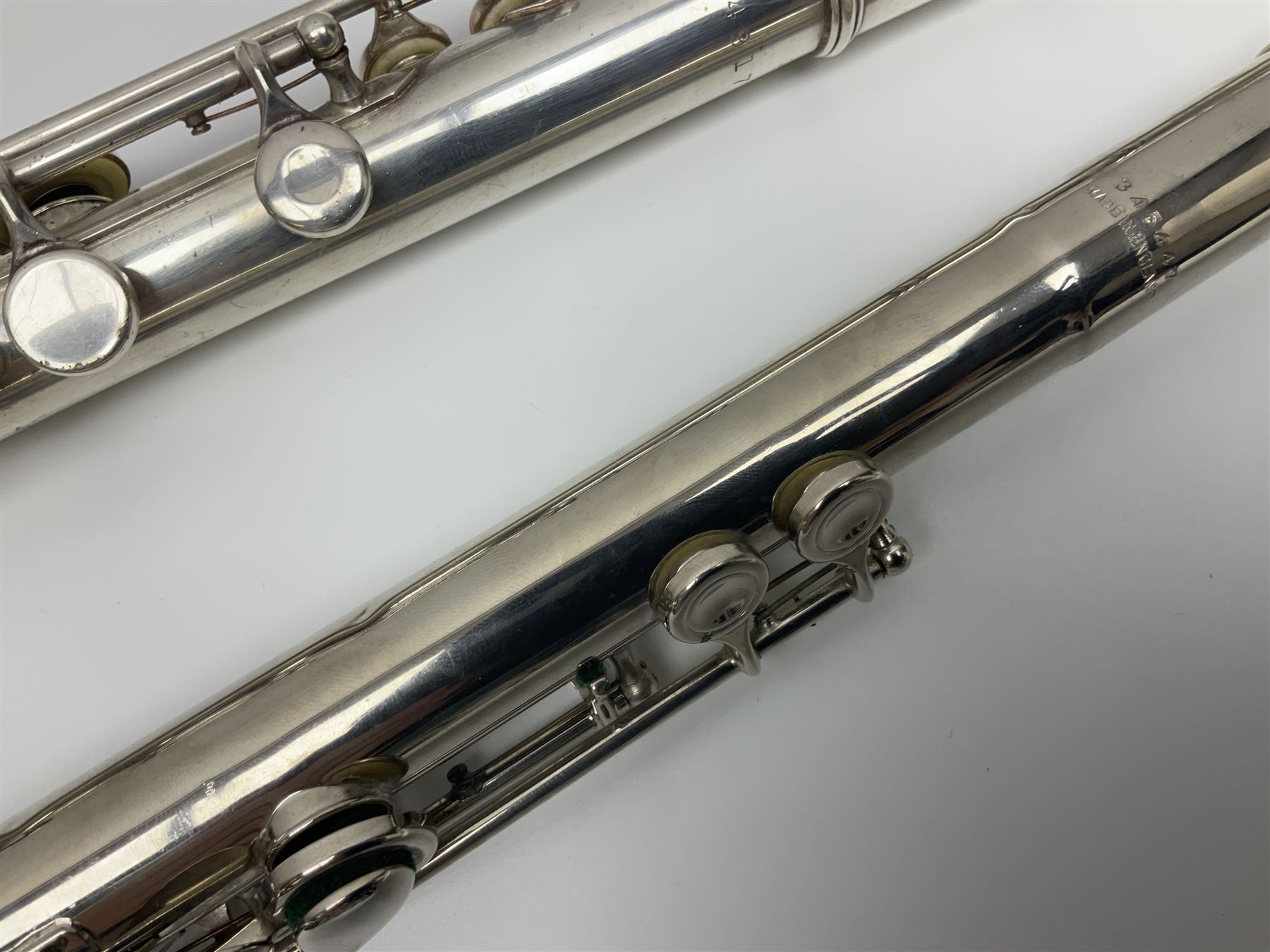 Boosey & Hawkes London Regent three-piece flute, serial no.345447; in B&H Bandhite hard carrying case; and Deg Music Company Inc. USA Claudel Model three-piece flute, serial no.491718, in hard carrying case (2)