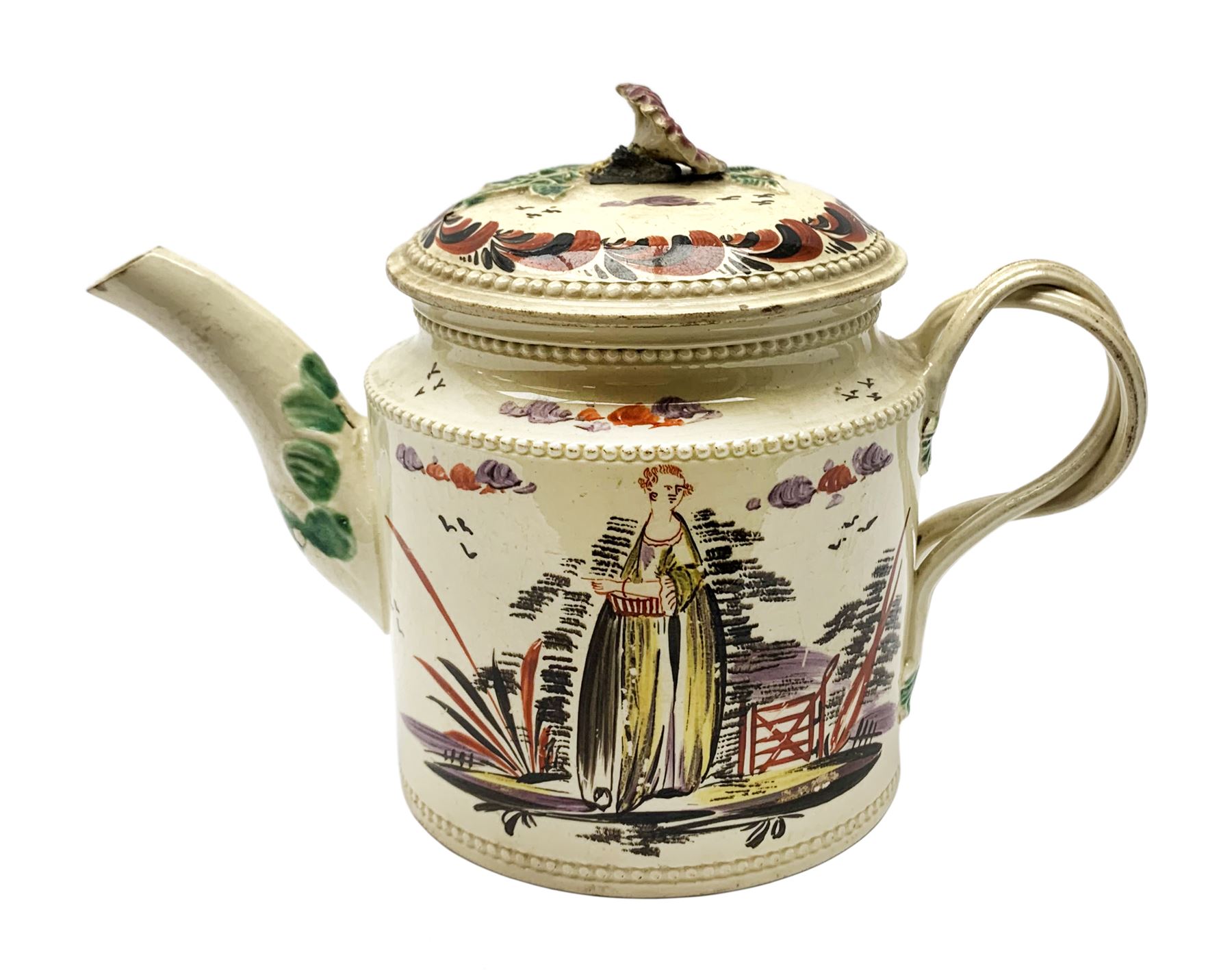 18th century creamware teapot, probably Leeds, with reeded entwined handle and floral finial to the cover, the body with hand painted polychrome decoration of figure to one side, and floral spray to the other, collectors paper label beneath inscribed Leeds Pottery, H11.5cm