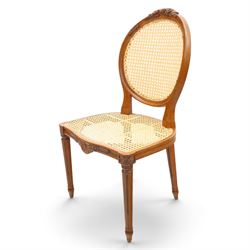 And So To Bed - French design 'Floral Caned Chair', balloon caned back with foliate carving, above a caned serpentine seat, reeded and turned supports