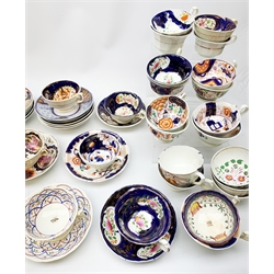  A large collection of assorted Gaudy Welsh style cups and saucers, each decorated with various floral designs in a palette of blue, red and pink, many examples with lustre detail. (Approx 34).   