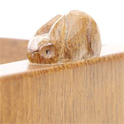 Rabbitman - oak glazed bookcase or display cabinet, lightly adzed rectangular top with raised gallery, twin glazed doors enclosing two shelves, over a pair of panelled cabinet doors with wrought iron fittings, with carved rabbit signature, by Peter Heap of Wetwang