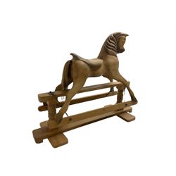 Terry White for White Horses (Hertfordshire 20th century) - Carved pine rocking horse, raised on a pine trestle base