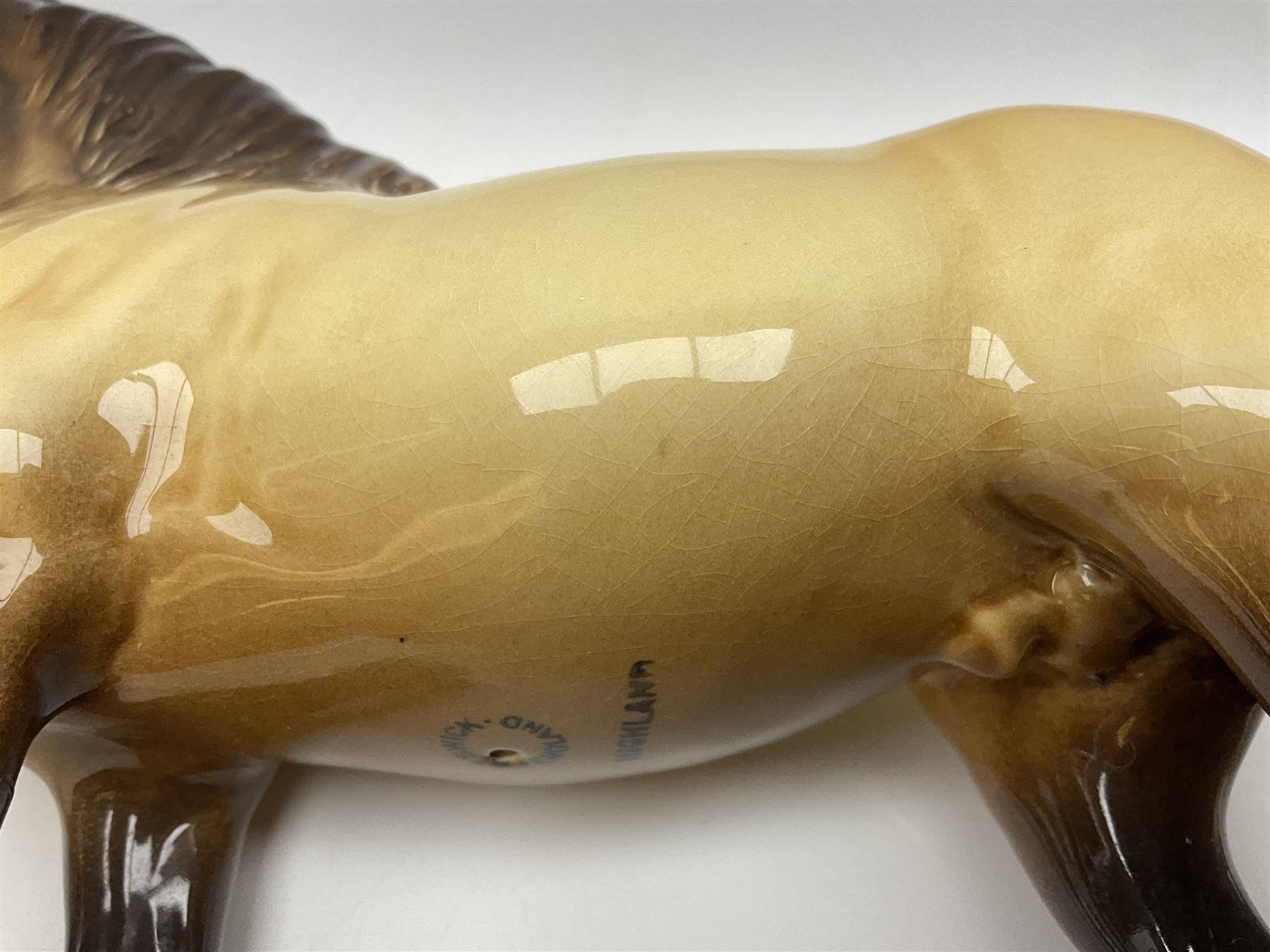 Beswick dun Highland pony no 1644 and piebald Pinto Pony  no 1373, both with printed mark beneath