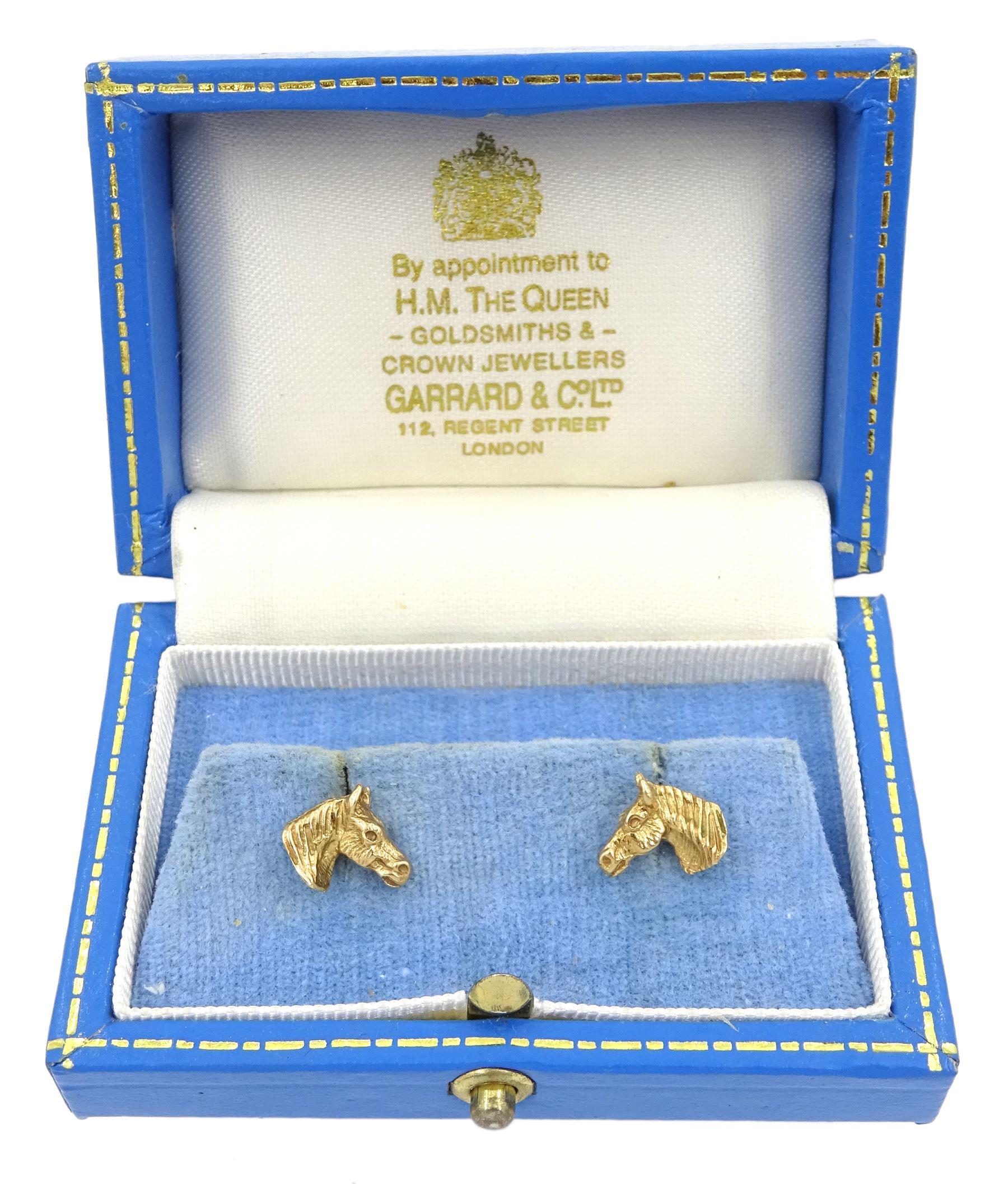 Pair of 9ct gold horse's head stud earrings, hallmarked, in Gerrard