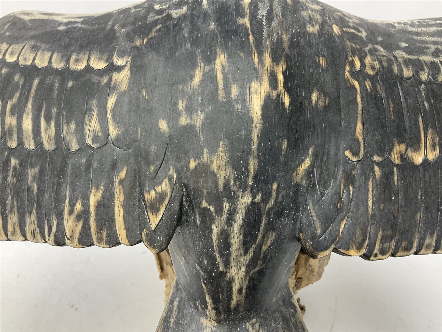 Wooden sculpture of Cormorant aquatic bird on a naturalistic wooden plinth, H46cm
