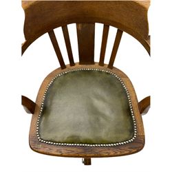 Early 20th century oak swivel desk chair, green leather seat with studded detail