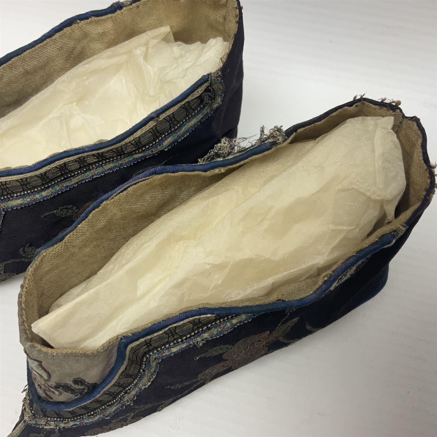 Pair of Chinese silk embroidered lotus shoes, for bound feet, a blue ground with floral detailing L15cm