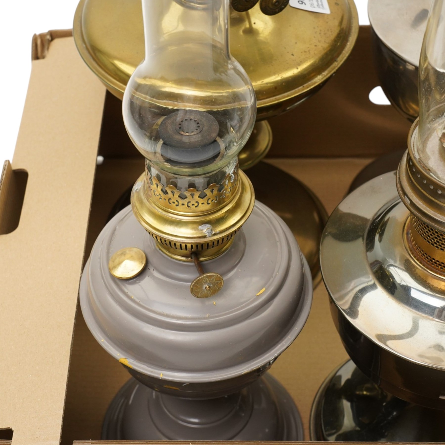 Brass table oil lamp of circular form, two Aladdin 23 lamps, Famos lamp and one other