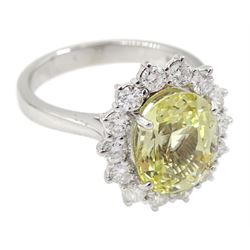 18ct white gold oval yellow sapphire and round brilliant cut diamond cluster ring, hallmarked, sapphire approx 4.20 carat