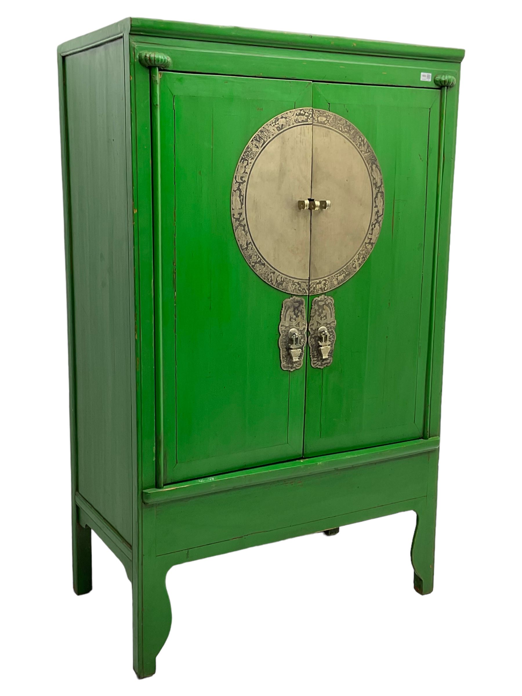 Chinese green lacquered hardwood moon cabinet, two panelled doors with metal mounts decorated with the zodiac animals and traditionally dressed figures, enclosing two drawers and shelves over single secret compartment