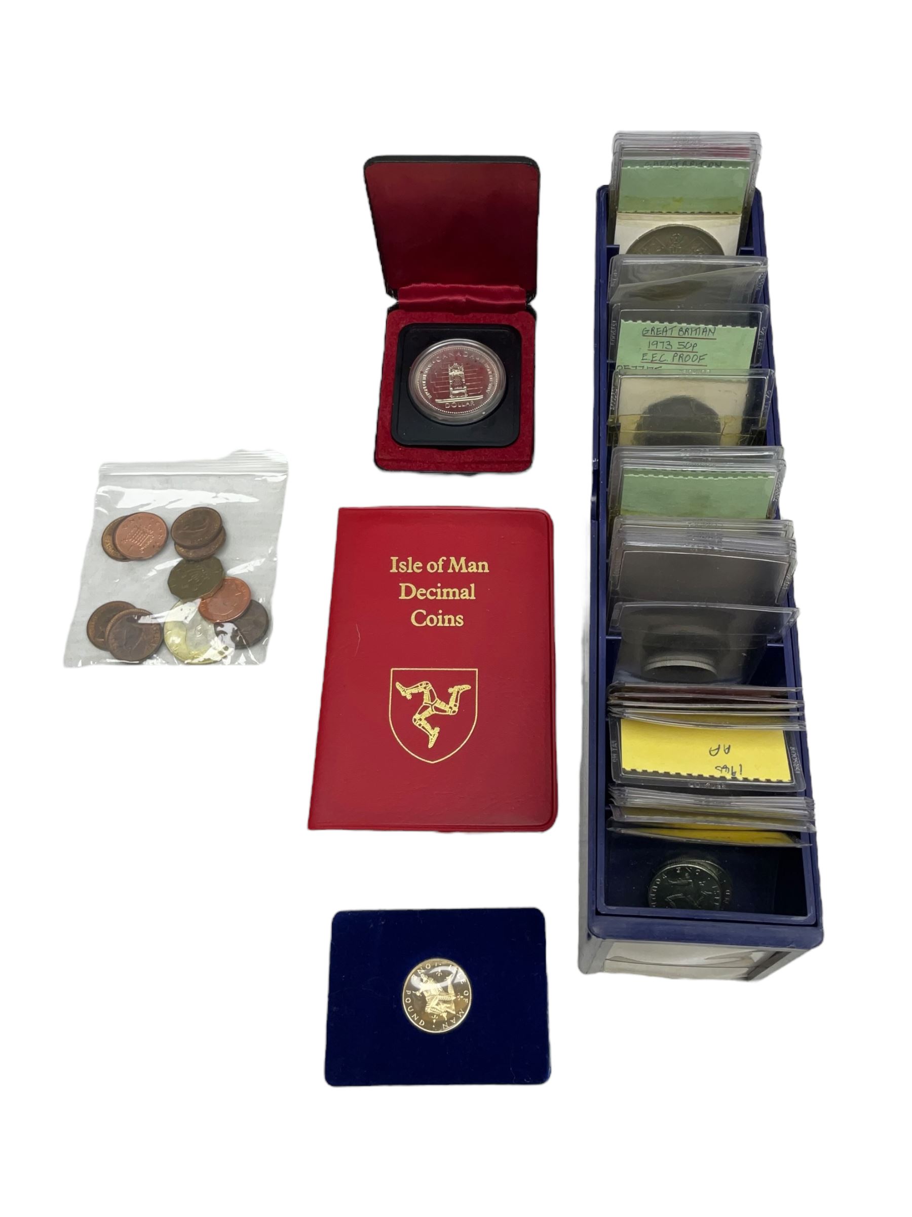 Great British and World coins, including various United States of America unofficial coin sets, Queen Elizabeth II Guernsey 1966 four coin set in The Royal Mint green case, Canada 1977 silver dollar, Isle of Man four coin crown set, Great British pre decimal coinage etc