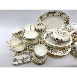 Wedgwood Hathaway Rose pattern dinner and tea wares, comprising eight dinner plates, eight salad plates, eight dessert plates, six side plates, six soup bowls and six saucers, sauce boat and stand, three oval serving dishes, oval serving platter, teapot, coffee pot, eight tea cups and eight saucers, eight coffee cans and eight saucers, two open sucriers, milk jug, cream jug, two ashtrays, and a lidded box and cover. 