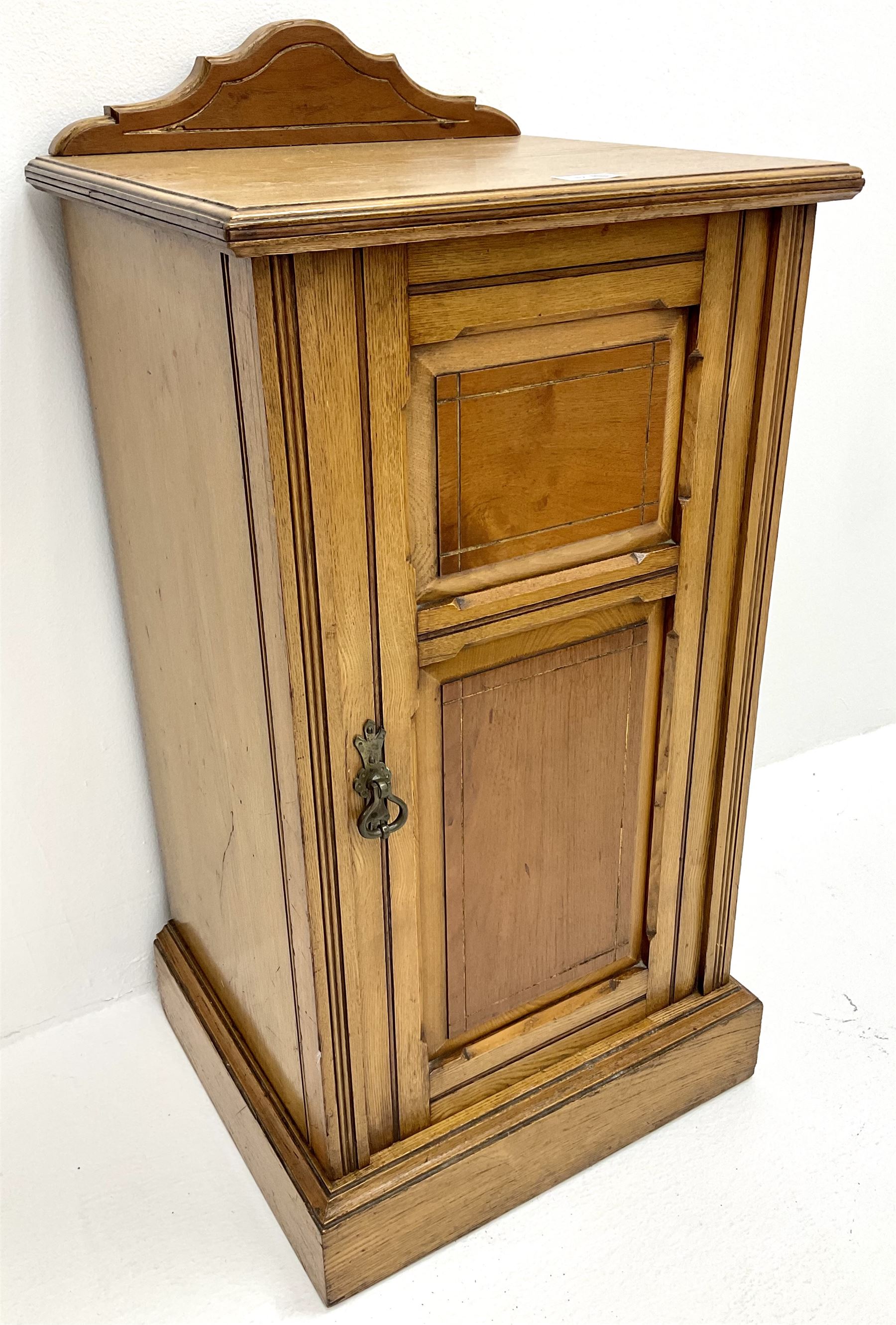 Edwardian ash bedside raised shaped back, single cupboard
