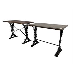Two pub or bistro tables, rectangular moulded tops on ornate cast iron supports, (107cm x 60cm, H74cm & 91cm x 61cm, H71cm)