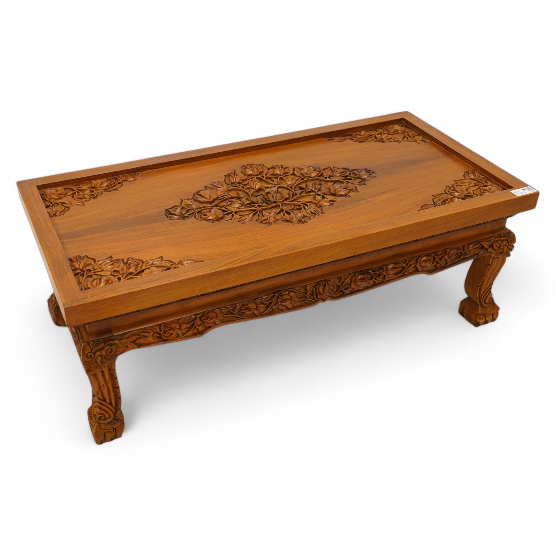 Hardwood rectangular coffee table, carved with trailing branches with foliage and flower heads, on scroll carved cabriole feet 