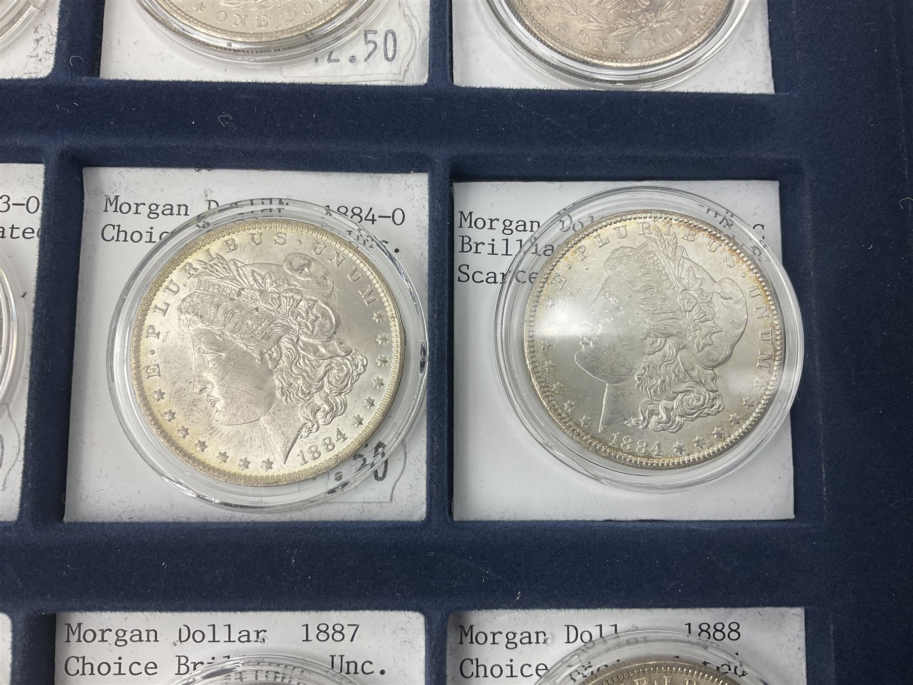 Twelve United States of America silver Morgan dollar coins, dated 1878 S, 1879 S, 1880 S, 1881 S, 1882 O, 1883 O, 1884 O, 1884 CC, 1885 O, 1886, 1887 and 1888