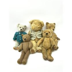 Four 1950s English teddy bears including wood wool filled Chiltern bear with swivel jointed head, glass type eyes and vertically stitched nose and mouth and jointed limbs with rexine paw pads H15
