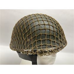 WW2 British Airborne Troops/Paratroopers Steel Helmet with green textured paint finish and netting cover, leather and sponge liner and three point chinstrap mounting; liner marked BMB 1943; together with a paratrooper's maroon beret with metal badge (2)