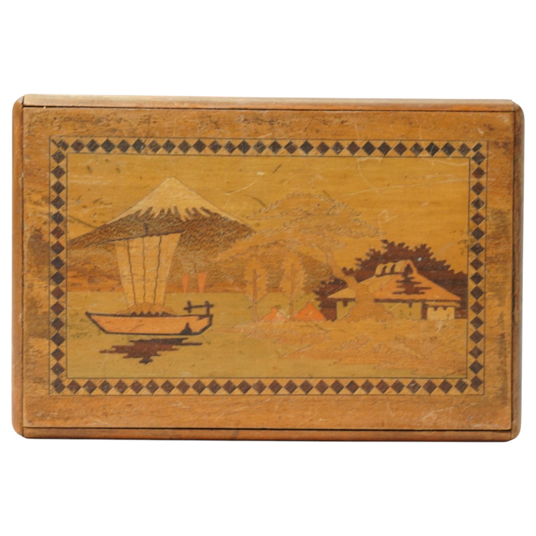 Japanese inlaid puzzle box, decorated with scenes of Mount Fuji and flowers, W15cm D10cm 