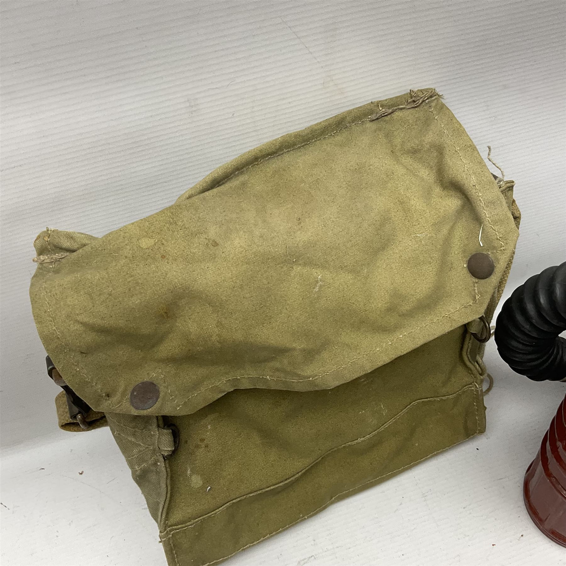 1970s British turtle style steel helmet with liner, green cover and netting; liner marked C.W.L. 1972 No.8415-99-973-6750; size 6 3/4 - 6 7/8; WWII respirator dated 1941 in canvas carrying case; and a Native long-shafted spear with iron head and bound plain round haft L165cm (3)