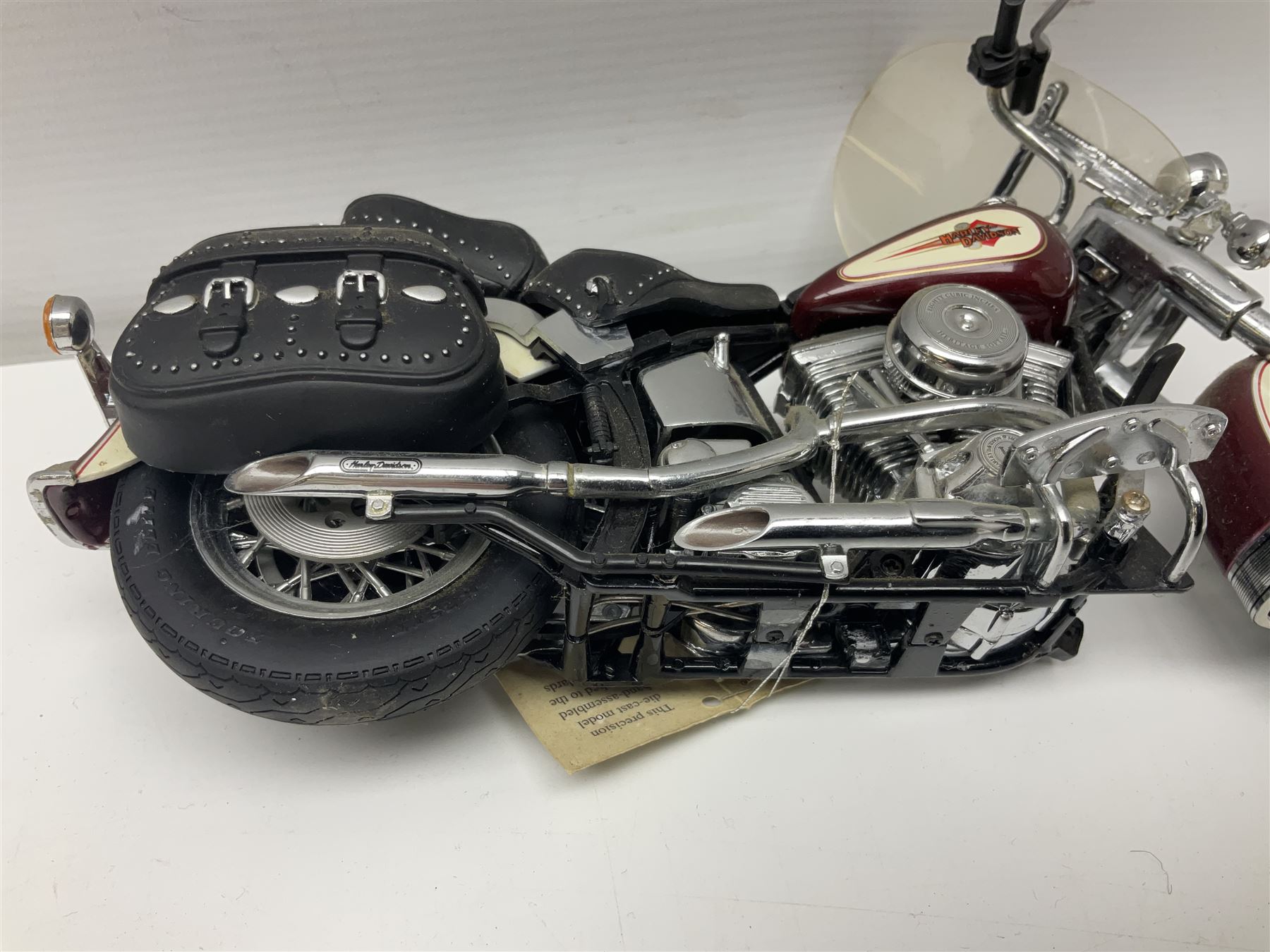 Franklin Mint - three die-cast models comprising 1:10 scale Harley Davidson Heritage Softail motorcycle, 1:24 scale 1957 VW Beetle and 1:24 scale 1993 Rolls Royce Corniche IV; all unboxed (3)