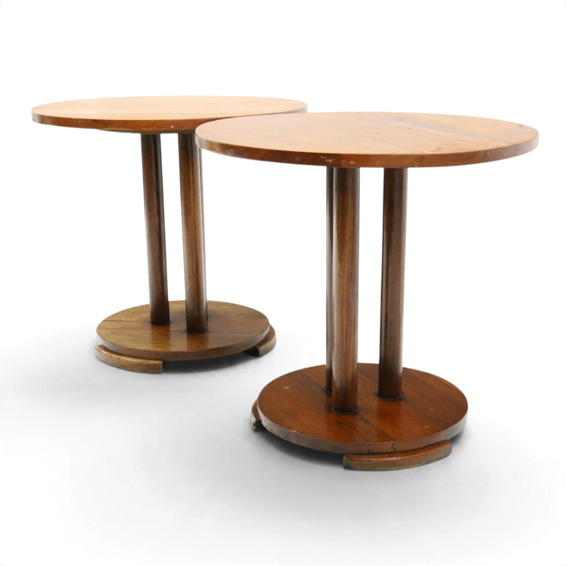Pair of early 20th century oak lamp tables, circular tops raised on cluster-column pedestals, with circular platform bases and shaped bracket feet (2)