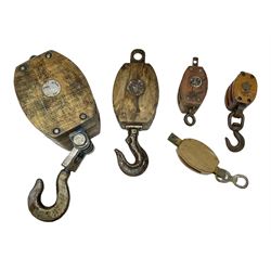 Five ship pulleys comprising two wooden block double with stiff swivel hook, wooden  with stiff swivel hook, and two more examples, largest example L60cm