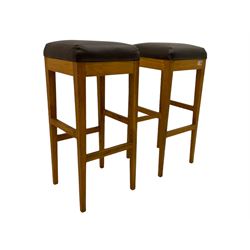 Pair of oak bar stools with leather type tops