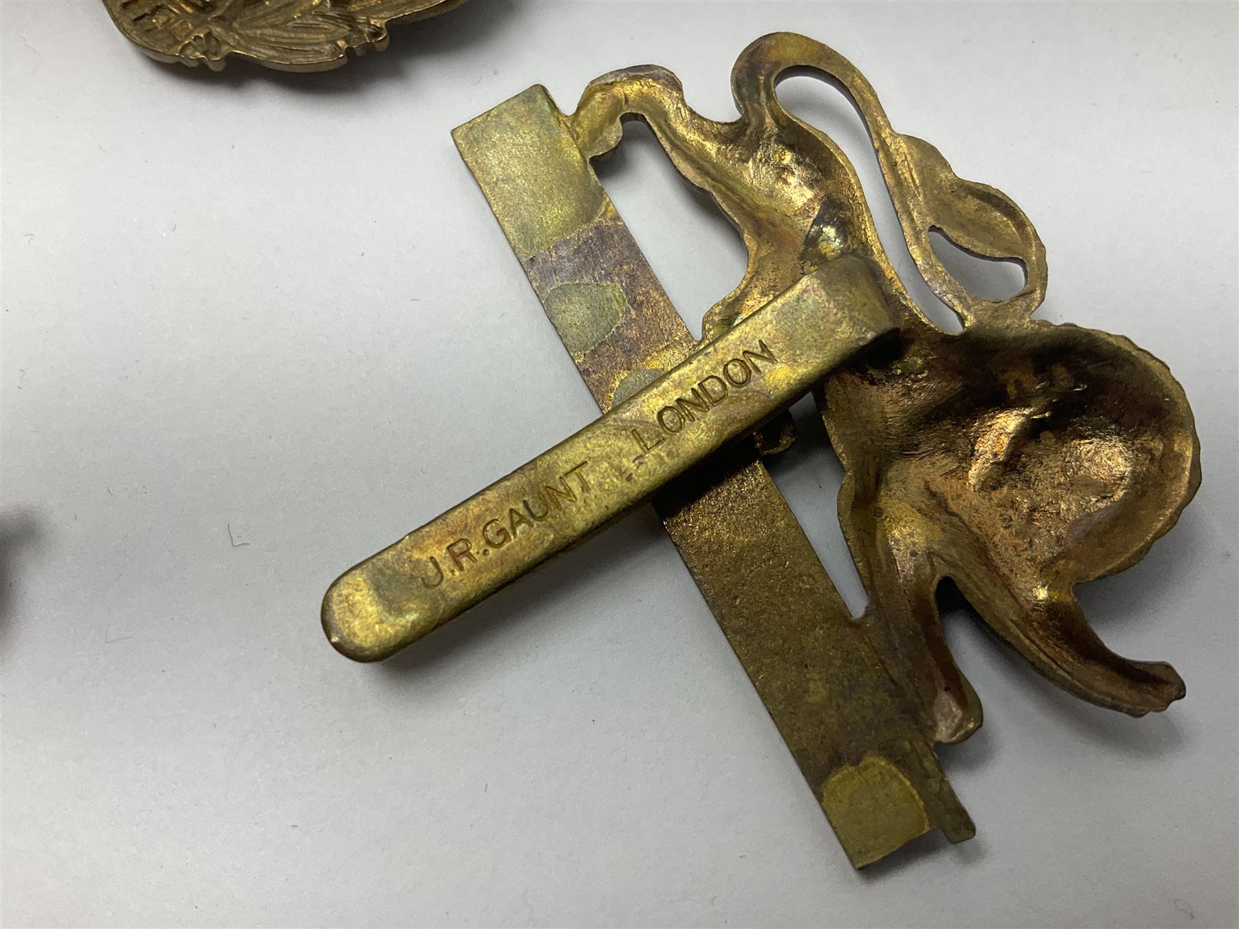 Twenty cap badges including Hertfordshire, Royal Sussex, Cambridgeshire, Hampshire, Notts and Derby, East Surrey, Herefordshire, South Lancashire, Devonshire, Bedfordshire, Durham Light Infantry etc (20)