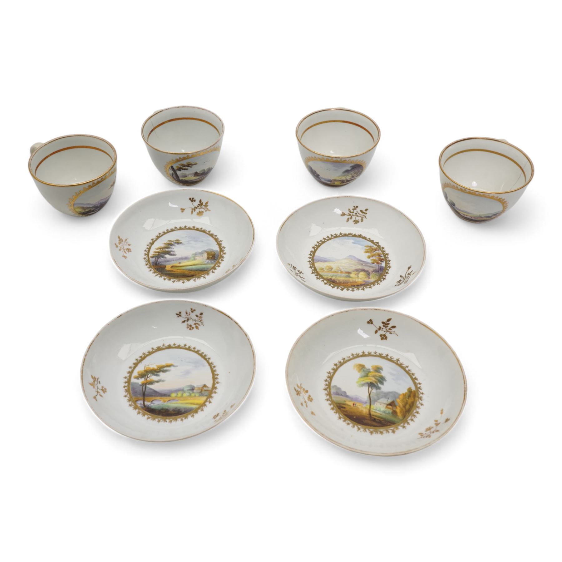 Set of four Pinxton porcelain bute shaped teacups and saucers, circa 1796-1813, pattern no. 58, painted in polychrome with circular landscape panels within gilt husks and sprigs, all saucers numbered 58 beneath, saucer D14cm, teacup H6cm (8)