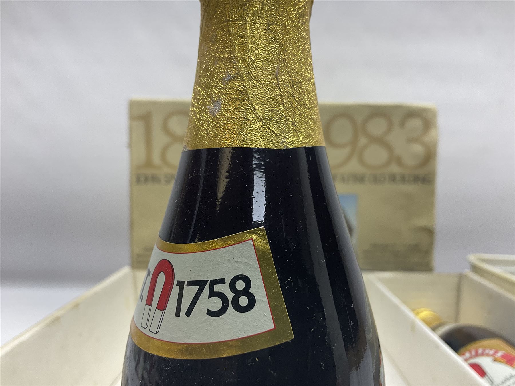 John Smiths presentation box commemorating 100 years of the Tadcaster brewery, containing two bottles of special brew and a glass, and a collection of lighters including Ronson and Jutson