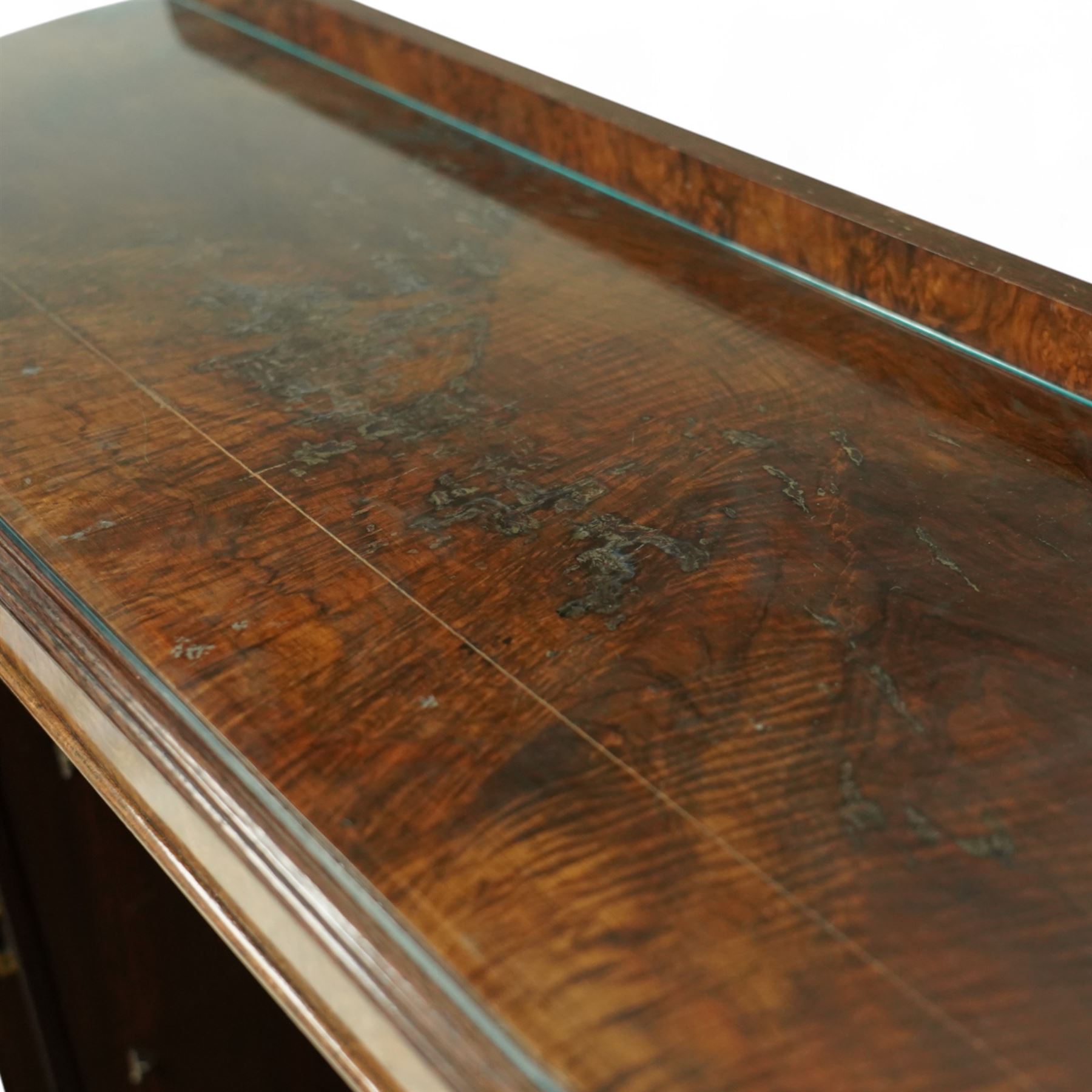 Early 20th century burr walnut display side cabinet, the glass inset top over a central glazed door with geometric astragal glazing, flanked by curved cupboards, shaped apron fitted with drawer, on cabriole legs with shell carved knees and pad feet