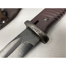 WWII German K98 Mauser bayonet by E. & F. Horster, the 24.5cm fullered blade marked 43aSW for 1943, numerous inspection marks to blade and pommel, bakelite grips and bluing to metal parts; in steel scabbard with corresponding numbers and leather frog L42cm overall